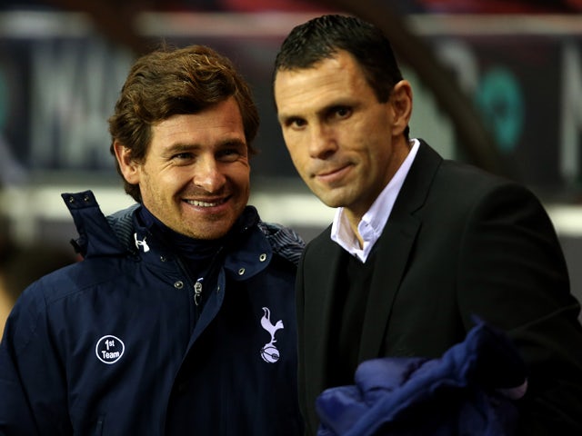 Manager of Sunderland Gus Poyet and Manager of Tottenham Hotspur Andre Villas Boas share a joke during the Barclays Premier League match between Sunderland and Tottenham Hotspur at the Stadium of Light on December 7, 2013