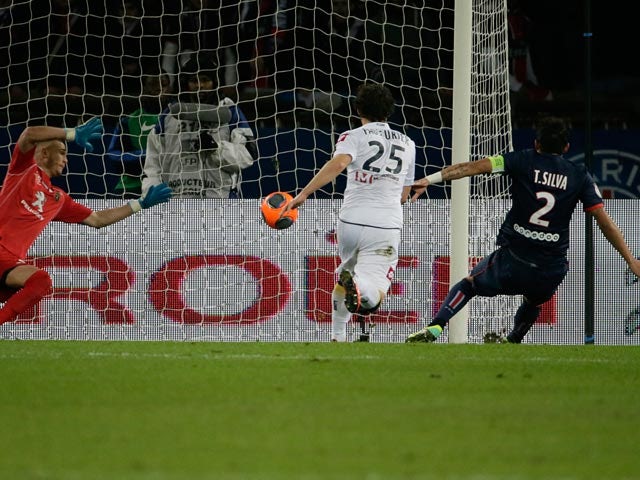 PSG's Thiago Silva scores the opening goal against Sochaux during their Ligue 1 match on December 7, 2013