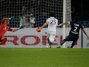 PSG's Thiago Silva scores the opening goal against Sochaux during their Ligue 1 match on December 7, 2013