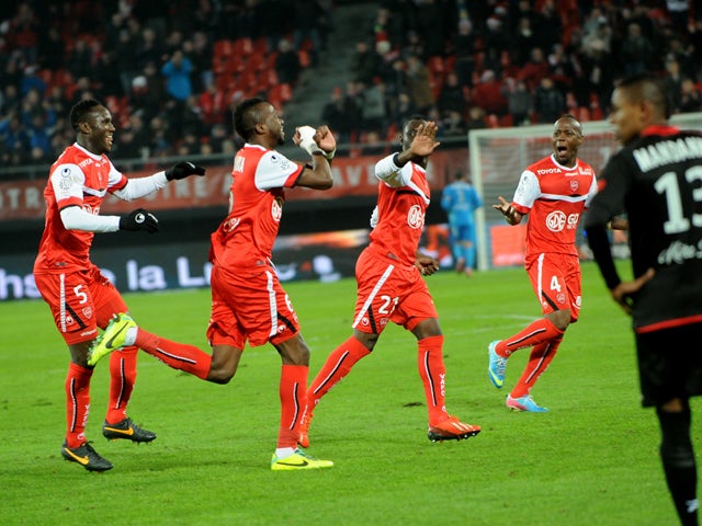 Valenciennes' Tongo Doumbia celebrates after scoring a goal during the French L1 football match Valenciennes vs Guingamp at Hainaut stadium in Valenciennes on December 7, 2013