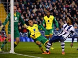 Stephane Sessegnon of West Bromwich has his shot on goal blocked by the arm of Martin Olsson of Norwich during the Barclays Premier League match between West Bromwich Albion and Norwich City at The Hawthorns on December 7, 2013