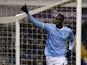 Man City's Yaya Toure celebrates after scoring his team's third goal via the penalty spot against West Brom during their Premier League match on December 4, 2013