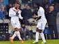 Lyon's French forward Alexandre Lacazette celebrates with Bafetimbi Gomis after scoring a goal during the French L1 football match against Marseille on December 15, 2013