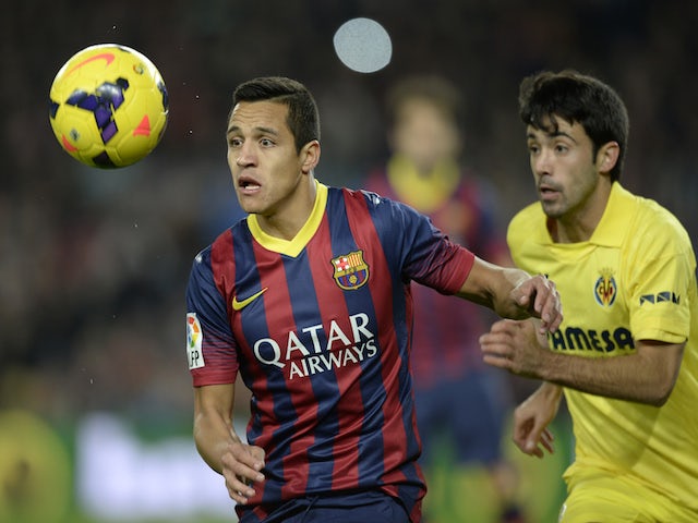 Barcelona's Chilean forward Alexis Sanchez (L) vies with Villarreal's defender Jaume Costa (R) during the Spanish league football match on December 14, 2013