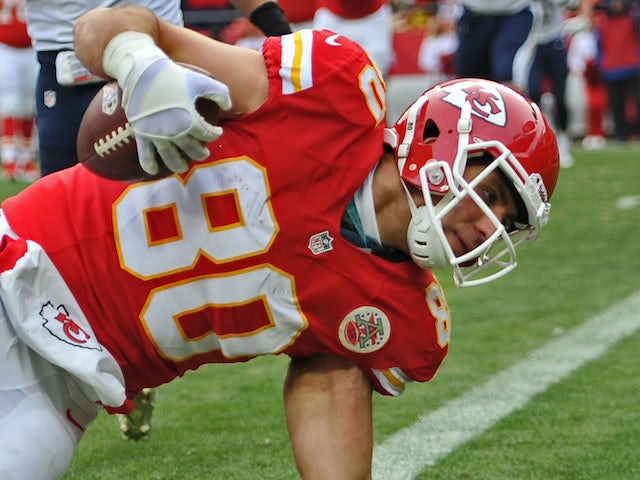 Tight end Anthony Fasano of the Kansas City Chiefs leans over the goal line for a touchdown against the San Diego Chargers during the second half on November 24, 2013