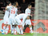 Monaco's French forward Anthony Martial celebrates with teammates after scoring a goal during the French L1 football match between Guingamp and Monaco on December 14, 2013