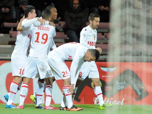 Monaco's French forward Anthony Martial celebrates with teammates after scoring a goal during the French L1 football match between Guingamp and Monaco on December 14, 2013
