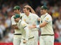Peter Siddle of Australia celebrates after dismissing Matt Prior of England with Mitchell Johnson, Michael Clarke and Shane Watson during day five of Second Ashes Test Match between Australia and England at Adelaide Oval on December 9, 2013