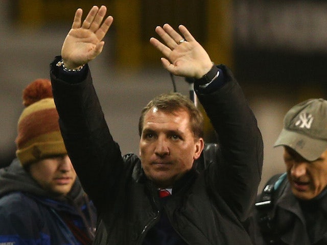 Manager Brendan Rodgers of Liverpool waves to the fans at the final whistle during the Barclays Premier League match against Tottenham Hotspur on December 15, 2013