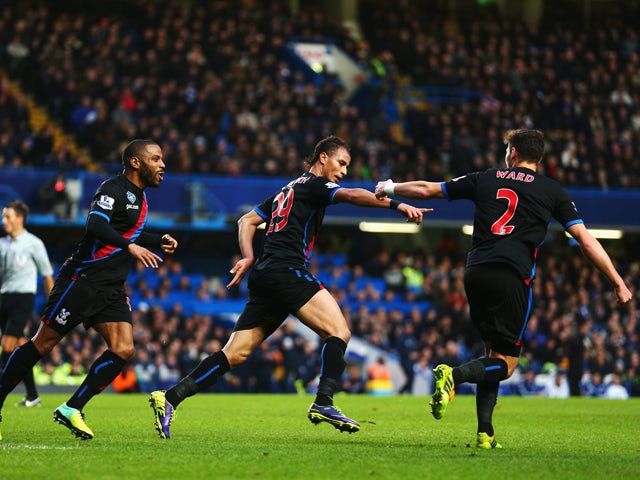 Marouane Chamakh of Crystal Palace celebrates with team mates after scoring during the Barclays Premier League match between Chelsea and Crystal Palace at Stamford Bridge on December 14, 2013