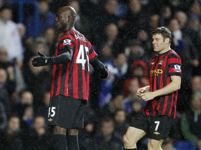 Manchester City's Italian player Mario Balotelli celebrates scoring his goal during an English Premier League football match between Chelsea and Manchester City at Stamford Bridge in London, on December 12, 2011