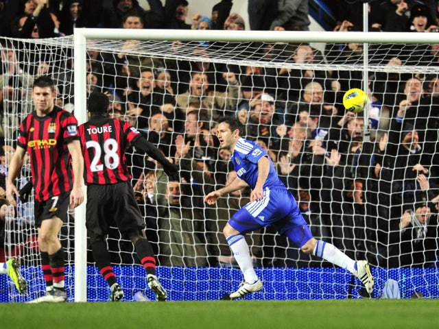 Chelsea's English midfielder Frank Lampard celebrates scoring a penalty goal during their English Premier League football match against Manchester City at Stamford Bridge in London, on December 12, 2011