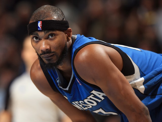 Corey Brewer #13 of the Minnesota Timberwolves looks on during a break in the action against the Denver Nuggets at Pepsi Center on November 15, 2013