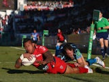David Smith of Toulon scores his second try despite the attentions of Luke Arscott of Exeter Chiefs during the Heineken Cup Pool Two match on December 14, 2013