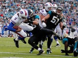 EJ Manuel of the Buffalo Bills crosses the goal line for a touchdown during the game against the Jacksonville Jaguars at EverBank Field on December 15, 2013