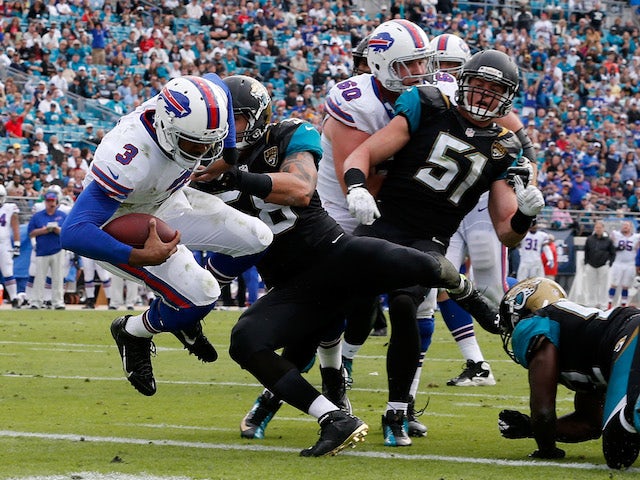 EJ Manuel of the Buffalo Bills crosses the goal line for a touchdown during the game against the Jacksonville Jaguars at EverBank Field on December 15, 2013