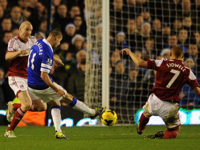 Kevin Mirallas of Everton scores his team's fourth goal during the Barclays Premier League match between Everton and Fulham at Goodison Park on December 14, 2013