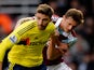 Fabio Borini of Sunderland is challenged by George McCartney of West Ham during the Barclays Premier League match between West Ham United and Sunderland at Boleyn Ground on December 14, 2013
