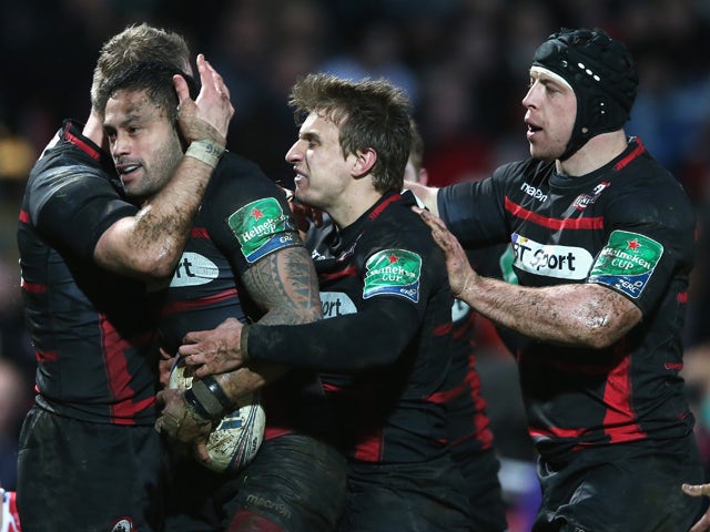 Ben Atiga of Edinburgh is congratulated by team mates after scoring a try during the Heineken Cup pool 6 match between Gloucester and Edinburgh at Kingsholm Stadium on December 15, 2013