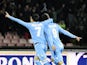 SSC Napoli's forward Gonzalo Higuain celebrates with his teammate Jose Maria Callejon after scoring during the Italian Serie A football match between SSC Napoli and Inter Milan on December 15, 2013