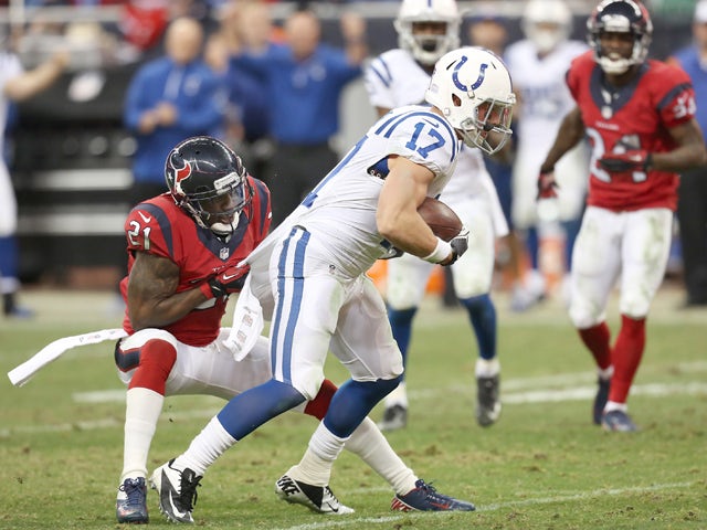 Griff Whalen #17 of the Indianapolis Colts is tackled by Brice McCain #21 of the Houston Texans on November 03, 2013