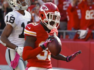 Husain Abdullah of the Kansas City Chiefs scores a touchdown on an interception against the Oakland Raiders in the fourth quarter October 13, 2013