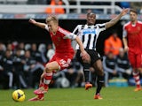 Southampton's English midfielder James Ward-Prowse (L) vies with Newcastle United's Dutch midfielder Vurnon Anita (R) during the English Premier League football match on December 14, 2013