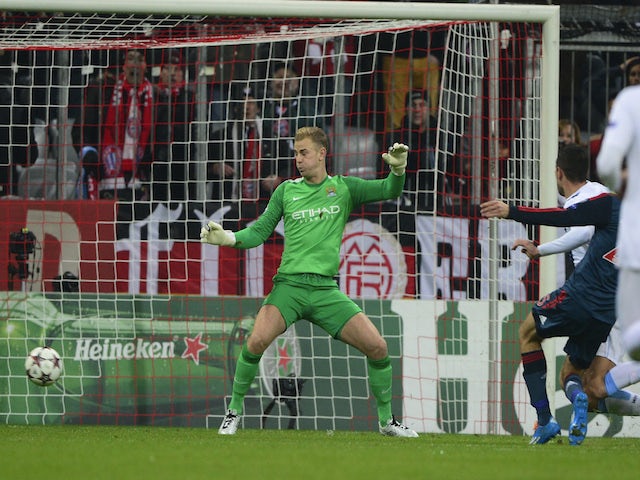 Manchester City's Joe Hart fails to save Bayern Munich's midfielder Thomas Mueller's goal during the UEFA Champions League group D football match on December 10, 2013