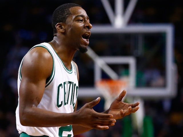 Jordan Crawford of the Boston Celtics argues with a referee in the second half against the Los Angeles Clippers during the game at TD Garden on December 11, 2013