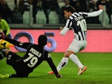 Juventus' Argentinian foward Carlos Alberto Tevez kicks and scores during their Serie A match Juventus vs Sassuolo at 'Juventus Stadium' in Turin on December 15, 2013
