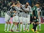 Juventus' players celebrate after scoring a goal during the Serie A football match between Juventus and Sassuolo at the Juventus Stadium in Turin on December 15, 2013