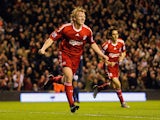 Dirk Kuyt of Liverpool celebrates scoring the opening goal during the Barclays Premier League match between Liverpool and Arsenal at Anfield on December 13, 2009