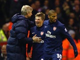 Andrey Arshavin of Arsenal celebrates scoring his team's second goal with Manager Arsene Wenger during the Barclays Premier League match between Liverpool and Arsenal at Anfield on December 13, 2009