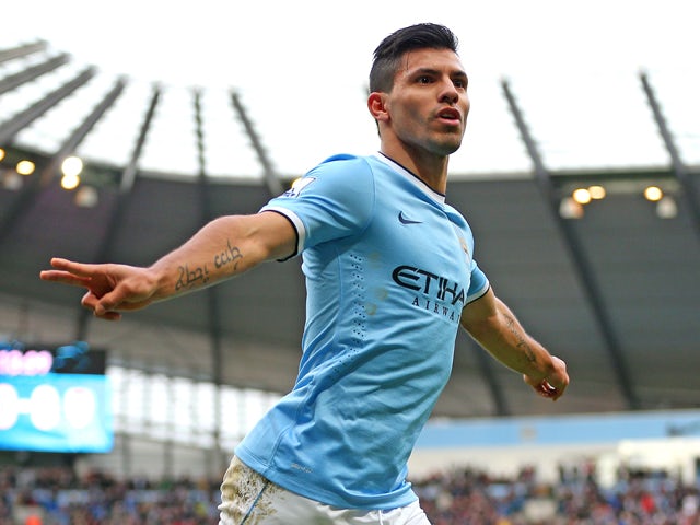 Sergio Aguero of Manchester City celebrates after scoring the opening goal during the Barclays Premier League match between Manchester City and Arsenal at Etihad Stadium on December 14, 2013