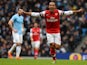 Arsenal's English midfielder Theo Walcott celebrates after scoring an equalising goal during the English Premier League football match between Manchester City and Arsenal at the Etihad Stadium in Manchester, northwest England, on December 14, 2013