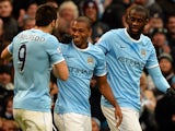 Manchester City's Brazilian midfielder Fernandinho celebrates scoring his team's third goal during the English Premier League football match between Manchester City and Arsenal at the Etihad Stadium in Manchester, northwest England, on December 14, 2013