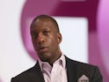 Retired US sprinter Michael Johnson speaks on the second day of the Doha Goals summit in the Qatari capital on December 11, 2013