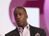 Retired US sprinter Michael Johnson speaks on the second day of the Doha Goals summit in the Qatari capital on December 11, 2013