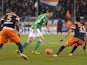 Saint-Etienne's French defender Francois Clerc vies for the ball with Montpellier's French mifielder Morgan Sanson and Montpellier's Ivoirian defender Siaka Tiene during the French L1 football match Montpellier vs Saint Etienne on December 13, 2013