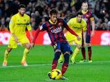 Neymar of FC Barcelona scores the opening goal from the penalty spot during the La Liga match between FC Barcelona and Villarreal CF at Camp Nou on December 14, 2013