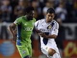 Obafemi Martins #9 of Seattle Sounders FC and A.J. DeLaGarza #20 of Los Angeles Galaxy fight for the ball in the second half at The Home Depot Center on May 26, 2013