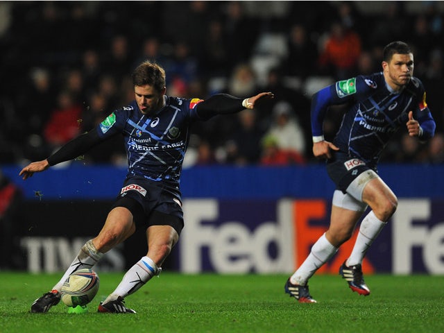 Castres kicker Rory Kockott kicks a penalty during the Heineken Cup pool 1 round 4 match between Ospreys and Castres Olympique at Liberty Stadium on December 13, 2013