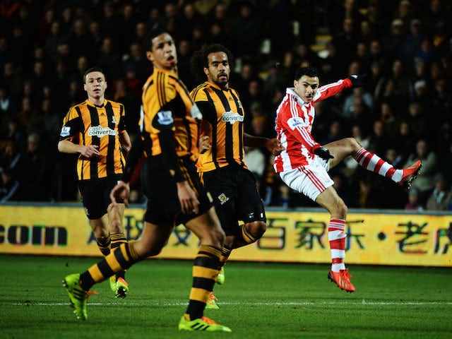 Oussama Assaidi of Stoke City shoots during the Barclays Premier League match between Hull City and Stoke City at KC Stadium on December 14, 2013
