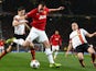 Phil Jones of Manchester United crosses the ball during the UEFA Champions League Group A match between Manchester United and Shakhtar Donetsk at Old Trafford on December 10, 2013