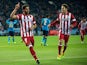 Raul Garcia celebrates scoring their opening goal with teammate Koke during the UEFA Champions League Group G match at Vicente Calderon Stadium on December 11, 2013