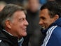 West Ham United's English manager Sam Allardyce (L) smiles as he welcomes Sunderland's Uruguayan manager Gus Poyet (R) ahead of the English Premier League football match on December 14, 2013