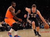 Tiago Splitter #22 of the San Antonio Spurs drives past Amar'e Stoudemire #1 of the New York Knicks during the second half at Madison Square Garden on November 10, 2013