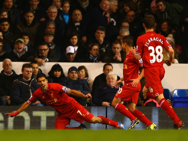 Captain Luis Suarez of Liverpool celebrates scoring the opening goal during the Barclays Premier League match between Tottenham Hotspur and Liverpool at White Hart Lane on December 15, 2013