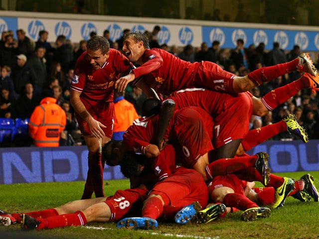 Jon Flanagan of Liverpool is mobbed by his team mates after scoring their third goal during the Barclays Premier League match between Tottenham Hotspur and Liverpool at White Hart Lane on December 15, 2013 