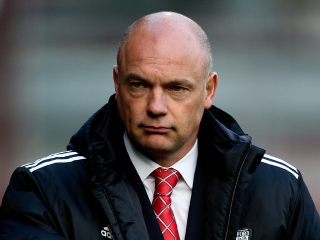 Brentford manager Uwe Rosler looks on ahead of the Sky Bet League One match between Brentford and Crewe Alexandra at Griffin Park on November 16, 2013